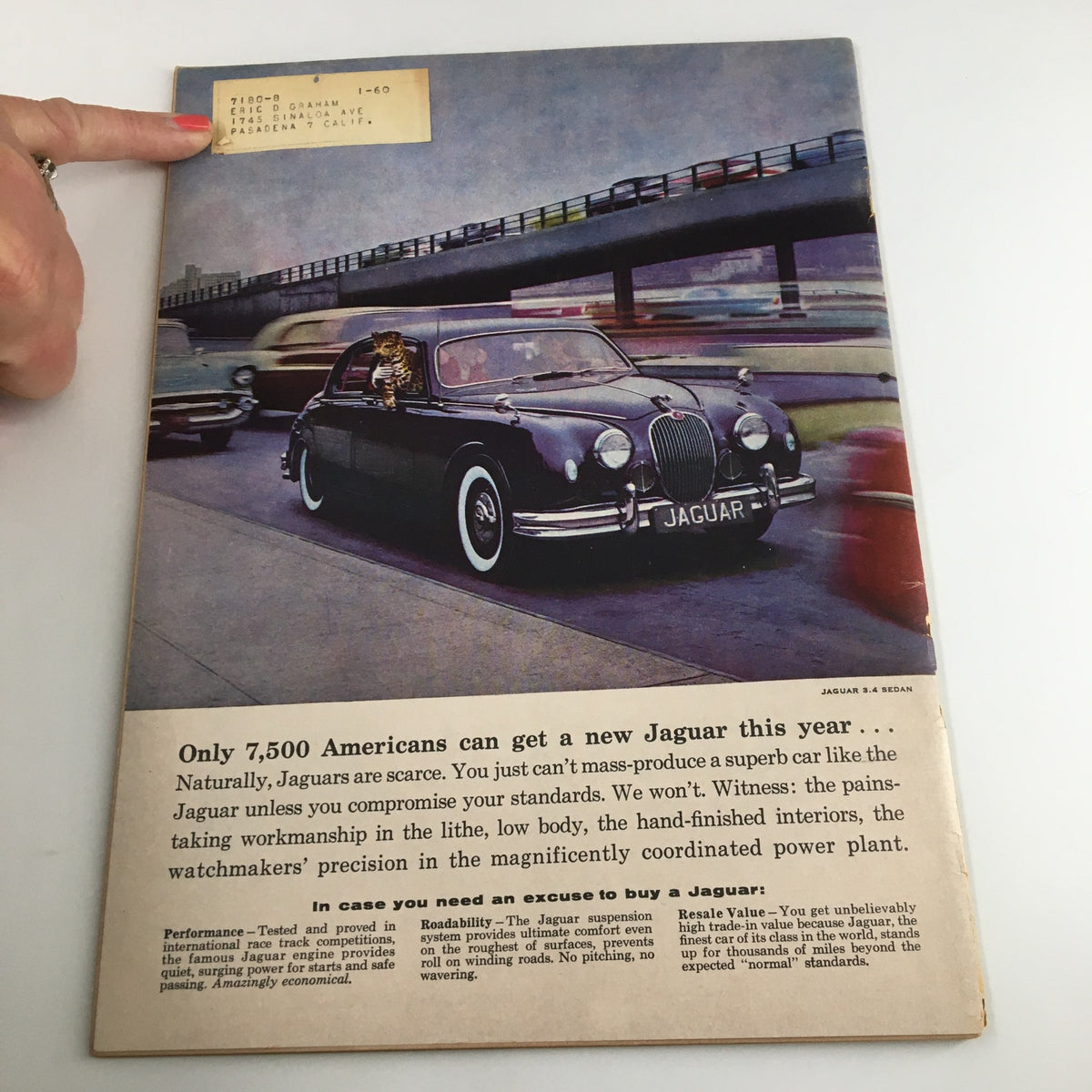Back cover of VTG Road & Track Magazine April 1958 featuring a Jaguar car advertisement, highlighting the features and standards of Jaguar vehicles.