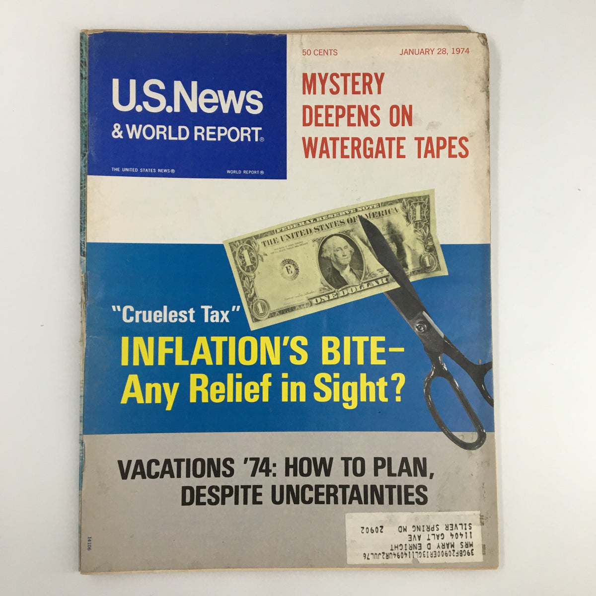 Cover of US News & World Report Magazine from January 28, 1974, featuring the title 'Cruelest Tax: Inflation's Bite.' The cover highlights economic issues with an image of a dollar bill and scissors, discussing tax inflation and upcoming vacation planning amidst uncertainties.
