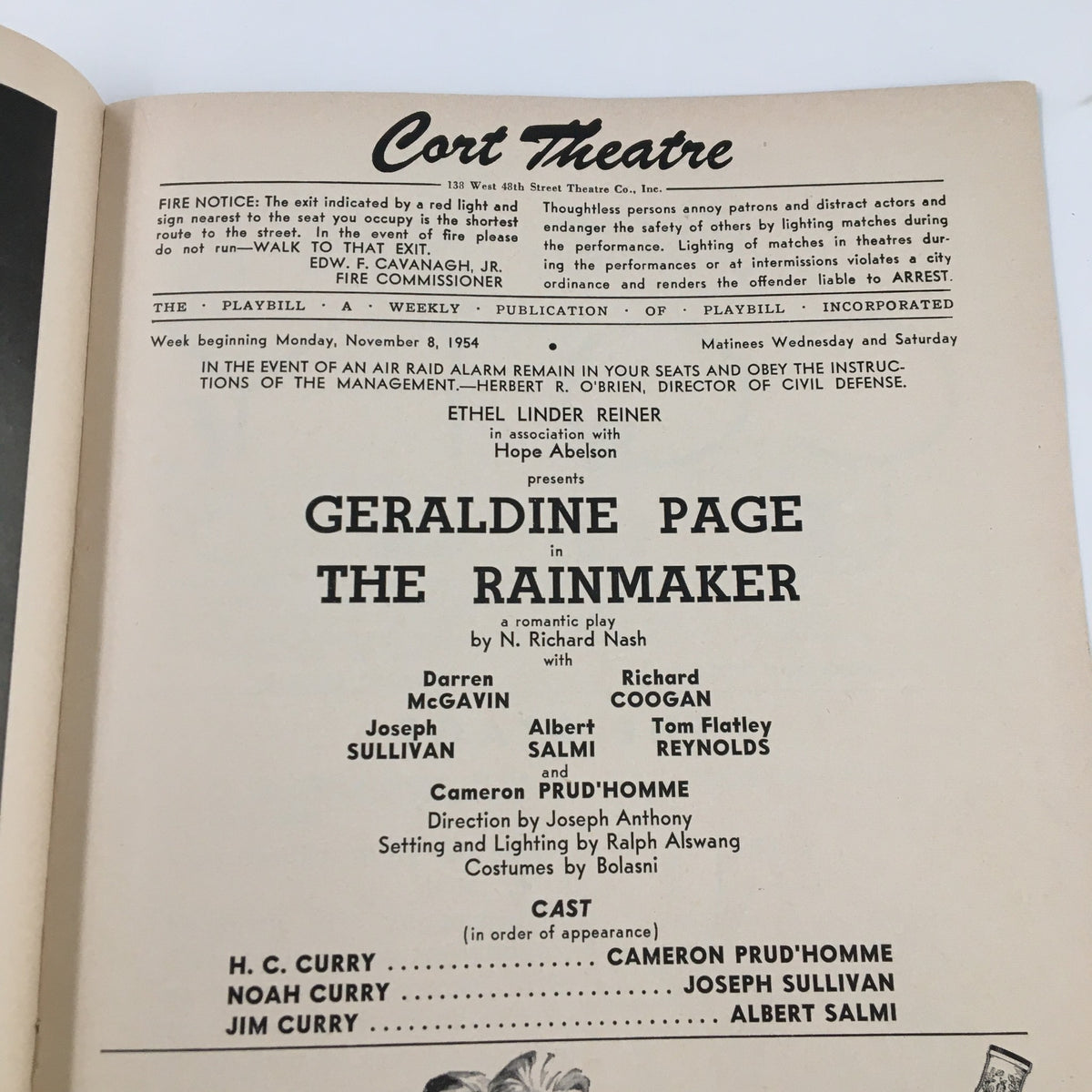 Inside view of the 1954 Playbill for The Rainmaker, highlighting the cast and crew details, including Geraldine Page in the lead role. The page is from the historic Cort Theatre, providing a glimpse into classic American theater.