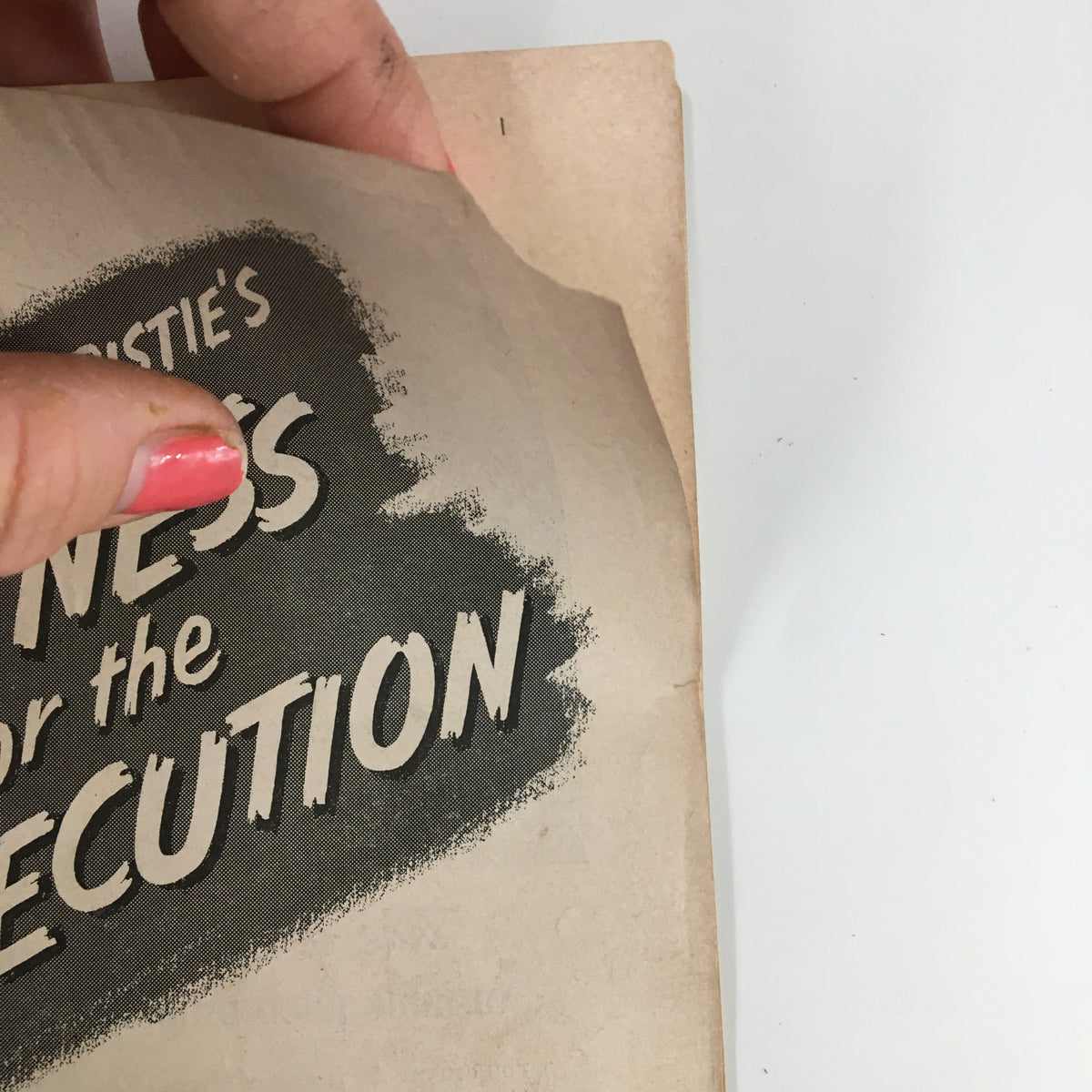 Close-up of the 1955 Playbill for Witness for the Prosecution by Agatha Christie, highlighting the title and texture of the vintage cover.