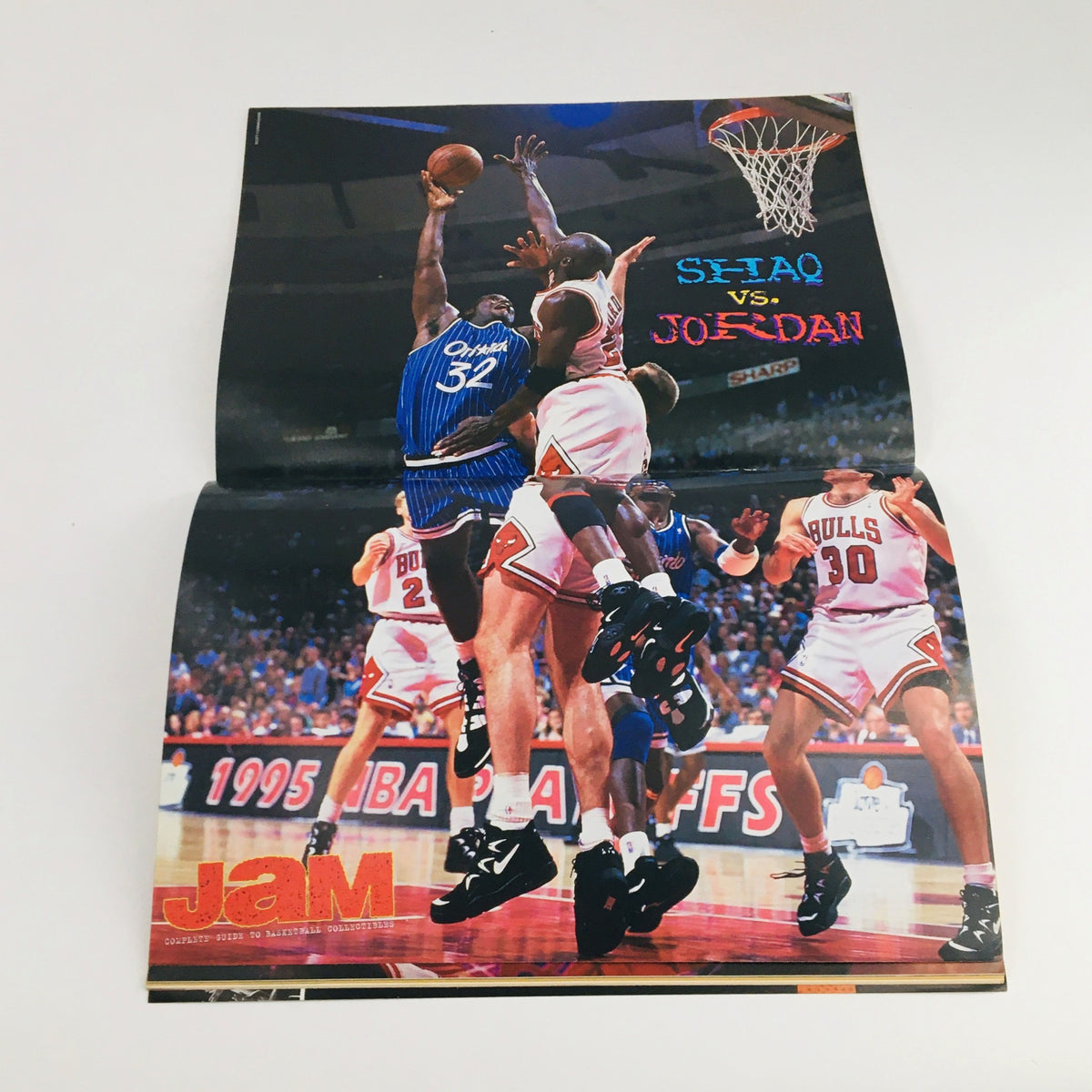 Inside poster of Jam Magazine 1996 displaying the iconic showdown between Shaquille O'Neal and Michael Jordan, illustrating a defining moment in basketball history.