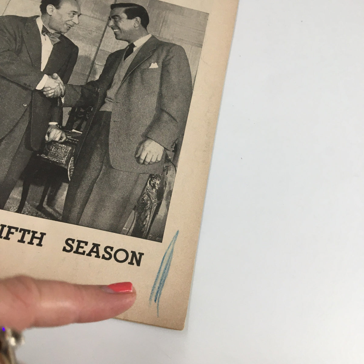 Close-up view of the 1954 Playbill for The Fifth Season at the Cort Theatre, highlighting Menasha Skulnik and a fellow actor in a handshake.