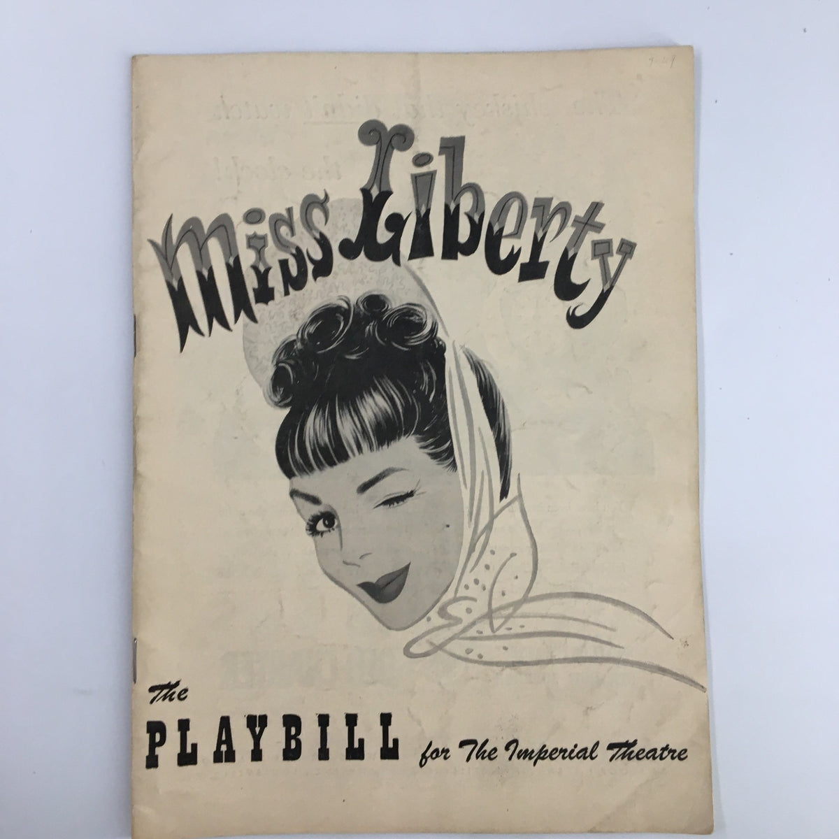 1949 Playbill The Imperial Theatre featuring Miss Liberty with a vintage illustration of a woman winking, showcasing the iconic performance starring Eddie Albert.
