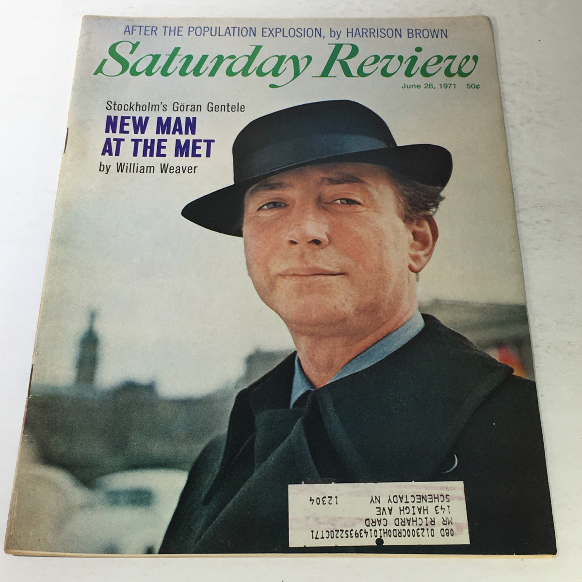 Cover of the Saturday Review magazine from June 26, 1971, featuring an article titled 'New Man At The Met' by William Weaver. The image shows a man wearing a fedora and a coat, set against a muted background, with the magazine title prominently displayed.