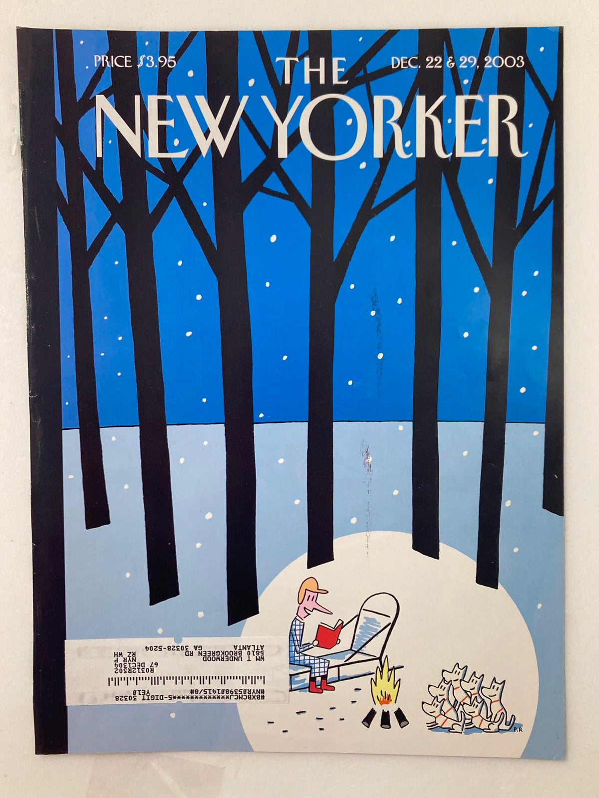 The New Yorker magazine cover dated December 22, 2003, titled 'Trails' by Philippe Petit-Roul, showcasing a winter scene with a man relaxing by a campfire amidst tall trees and a group of dogs.
