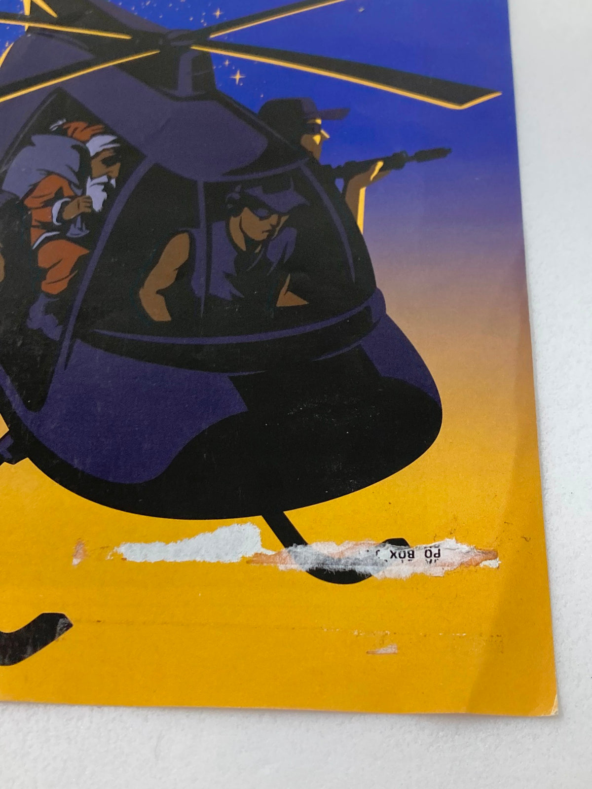 Detail close-up of The New Yorker December 3 2007 cover 'Violent Night' by Christoph Niemann, highlighting a torn area along the bottom.