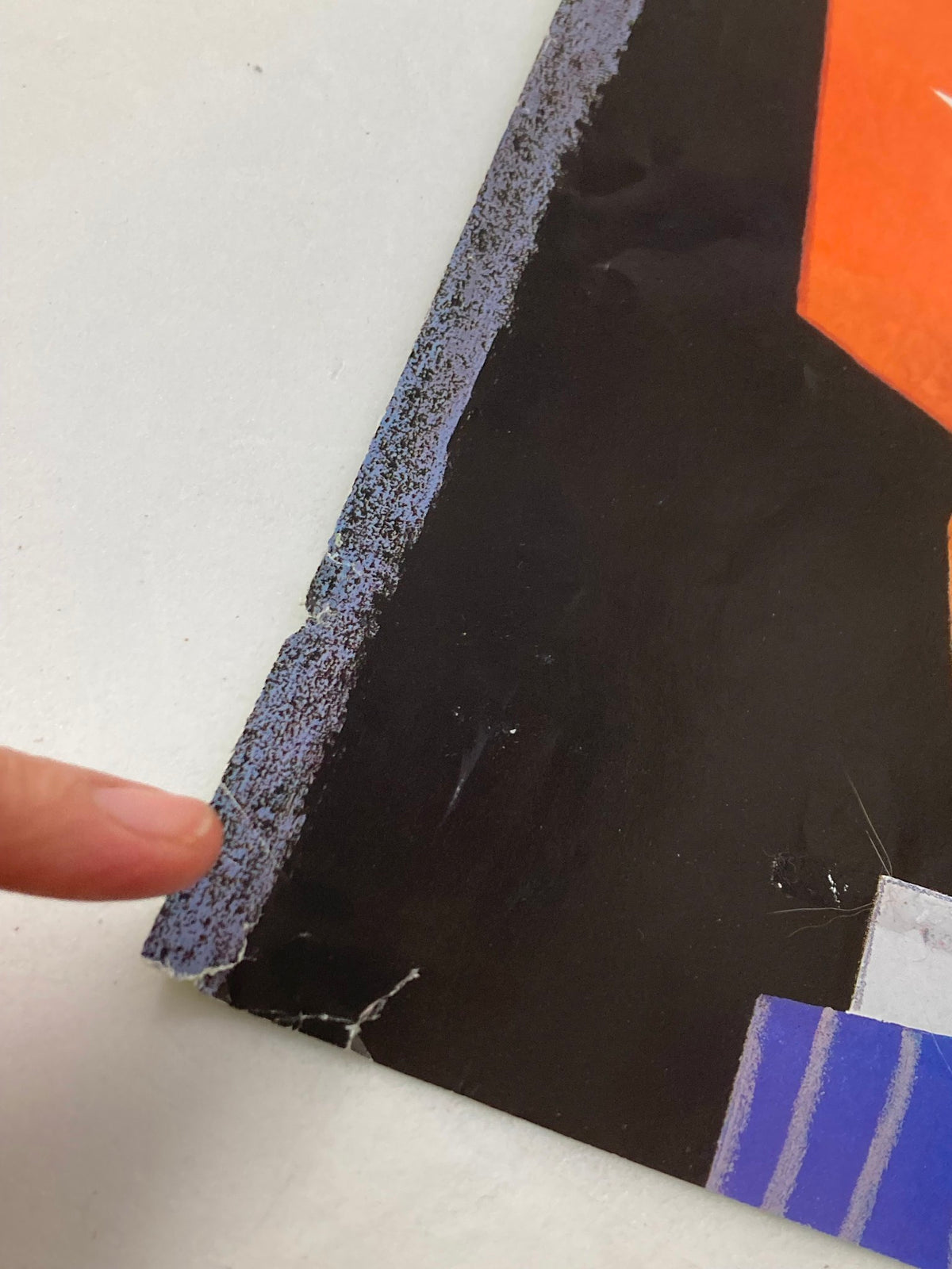 Detailed image of the edge of The New Yorker cover from October 2, 2000, 'Page-Turner' by Ana Juan, highlighting wear and tear.