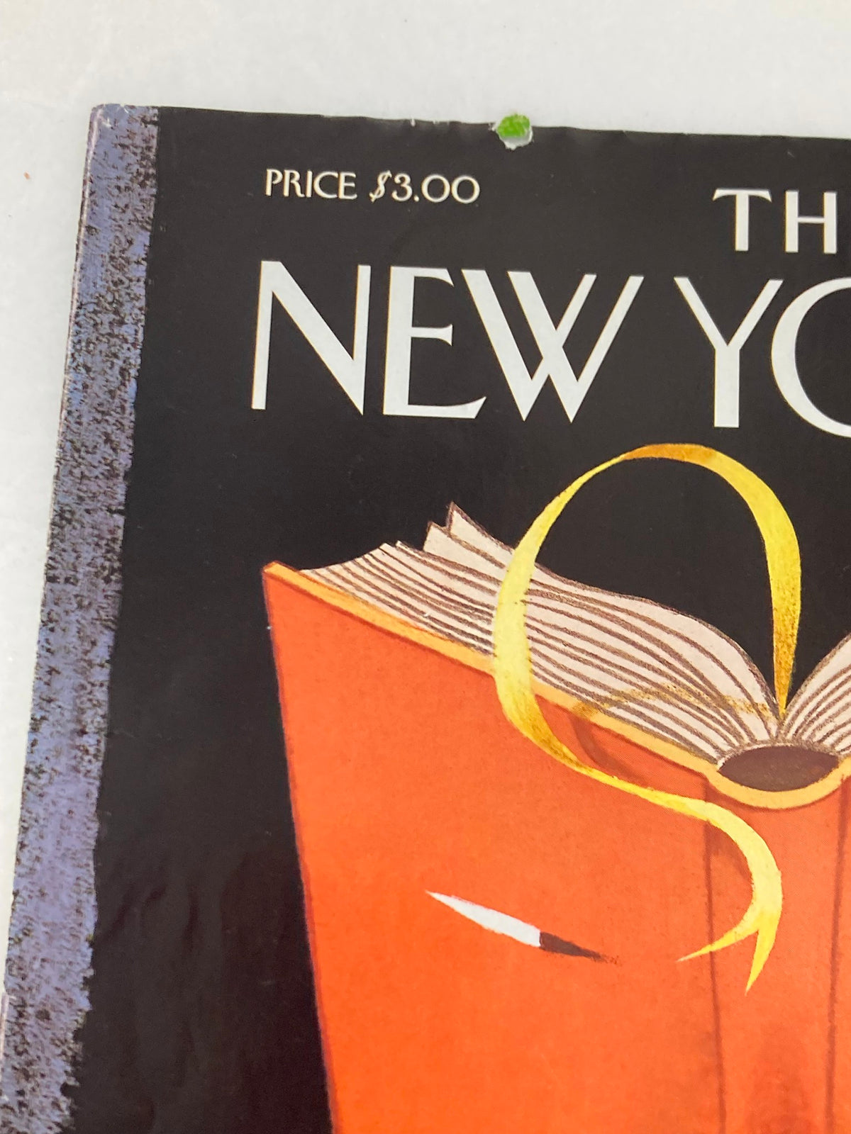 Top corner close-up of The New Yorker magazine cover, October 2, 2000, 'Page-Turner' by Ana Juan, displaying the price and slight imperfections.