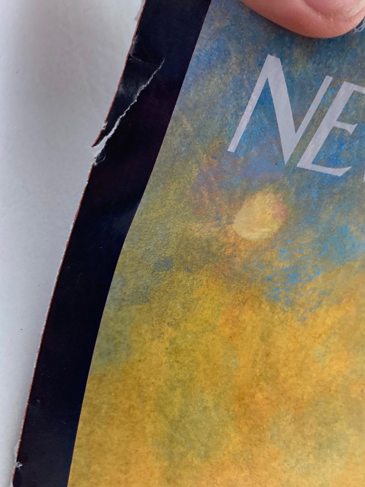 Detailed image of the edge of The New Yorker cover dated September 16, 2002, highlighting wear on the illustration 'Dawn Over Manhattan' by Ana Juan.