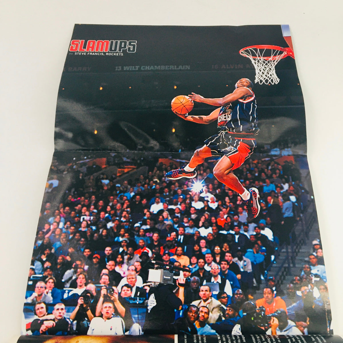 Poster from Slam Magazine May 2000 displaying a dynamic dunk during an All-Star game, celebrates basketball excitement.