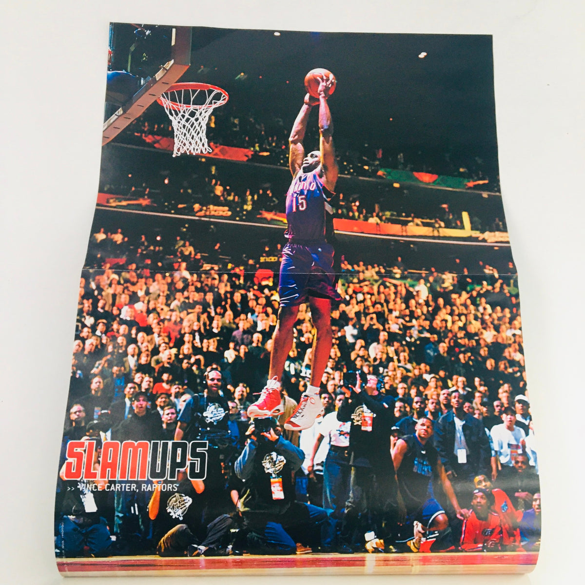 Poster from Slam Magazine May 2000 featuring Vince Carter performing a slam dunk, capturing the thrilling atmosphere of the NBA.