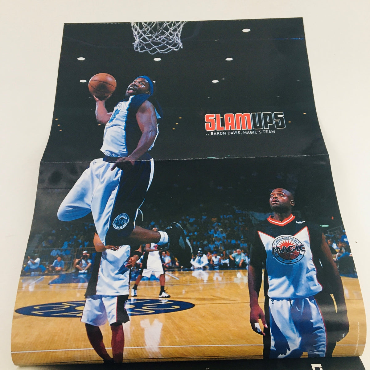 Folded poster from Slam Magazine November 2000 Issue #46 showcasing a dynamic dunk by an NBA player in a game setting.