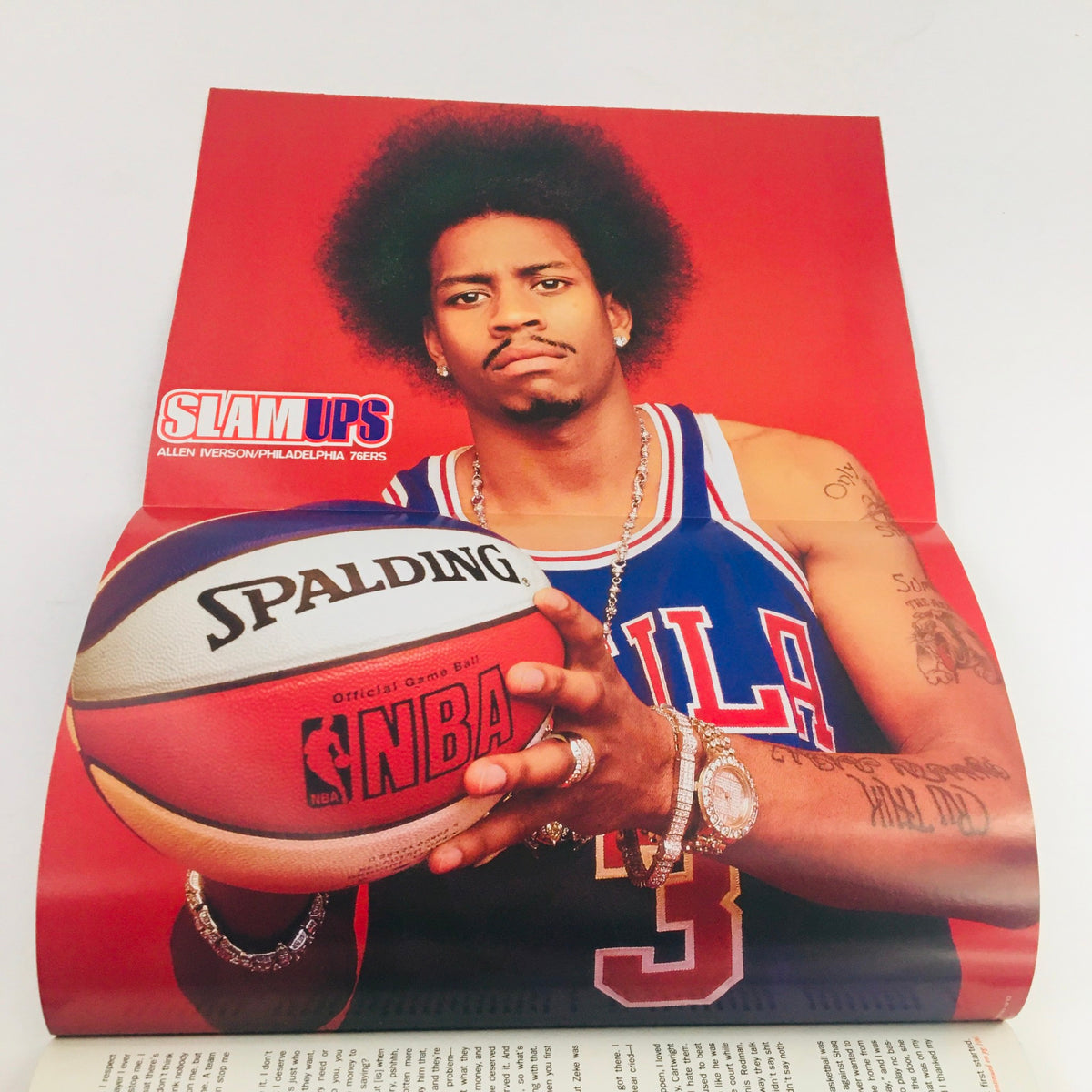 Slam Magazine March 1999 features a striking poster of NBA star Allen Iverson wearing a Philadelphia 76ers jersey, highlighting his bold personality and basketball prowess.
