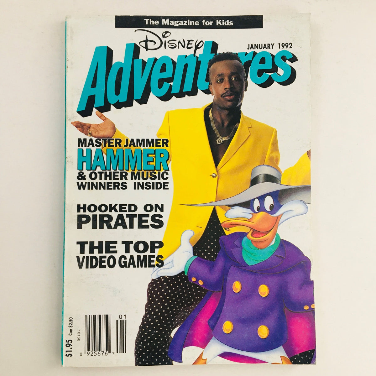 Cover of Disney Adventures Magazine January 1992 featuring MC Hammer in a bright yellow jacket alongside Disney character DuckTales' Scrooge McDuck, highlighting retro pop culture and vintage magazine appeal.