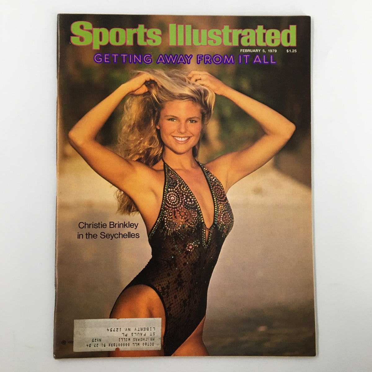 Vintage Sports Illustrated Magazine cover from February 5, 1979 featuring Christie Brinkley in a stunning bathing suit, with a backdrop of the picturesque Seychelles, highlighting her iconic beauty and charm.