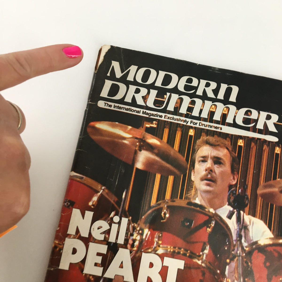 Cover of the VTG Modern Drummer Magazine April 1984 featuring drummer Neil Peart. The magazine showcases articles on drumming techniques and the 1980s rock scene.