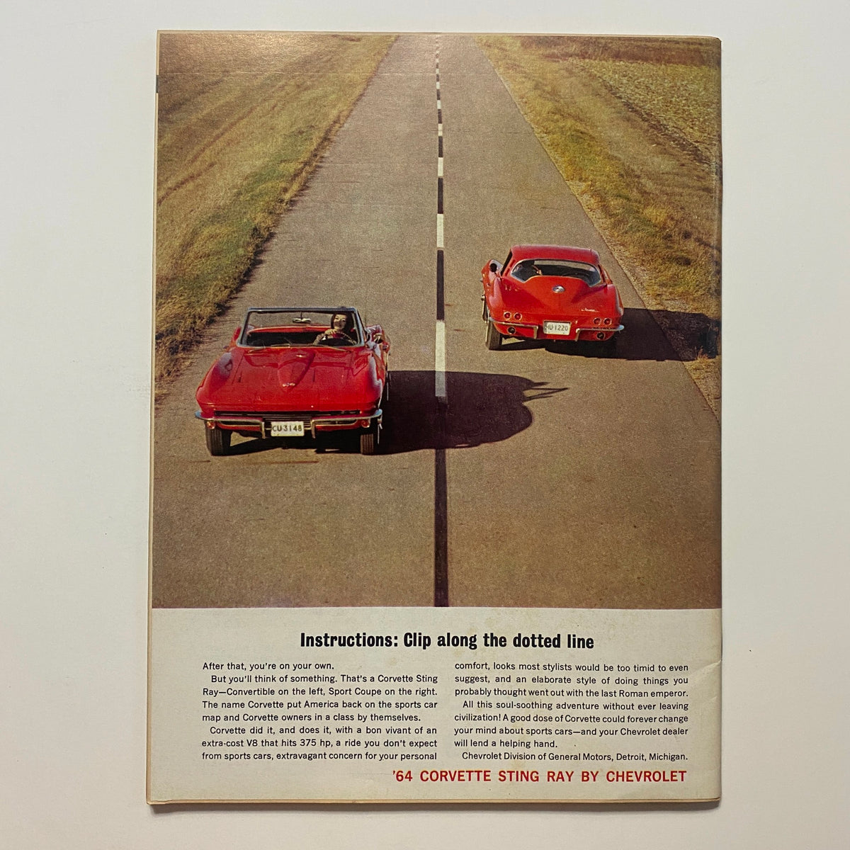 Back cover of VTG Car Life Magazine May 1964 showing two red Corvettes on an open road with promotional text for the Corvette Sting Ray.