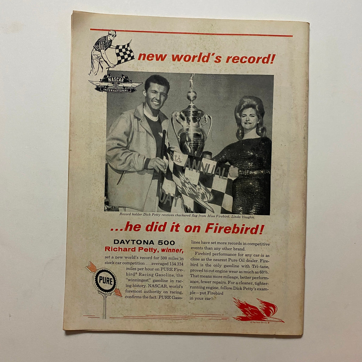 Auto Sports The Racing Fan Magazine June 1964 featuring Dick Petty receiving the checkered flag at the Daytona 500, capturing a historic moment in NASCAR racing.