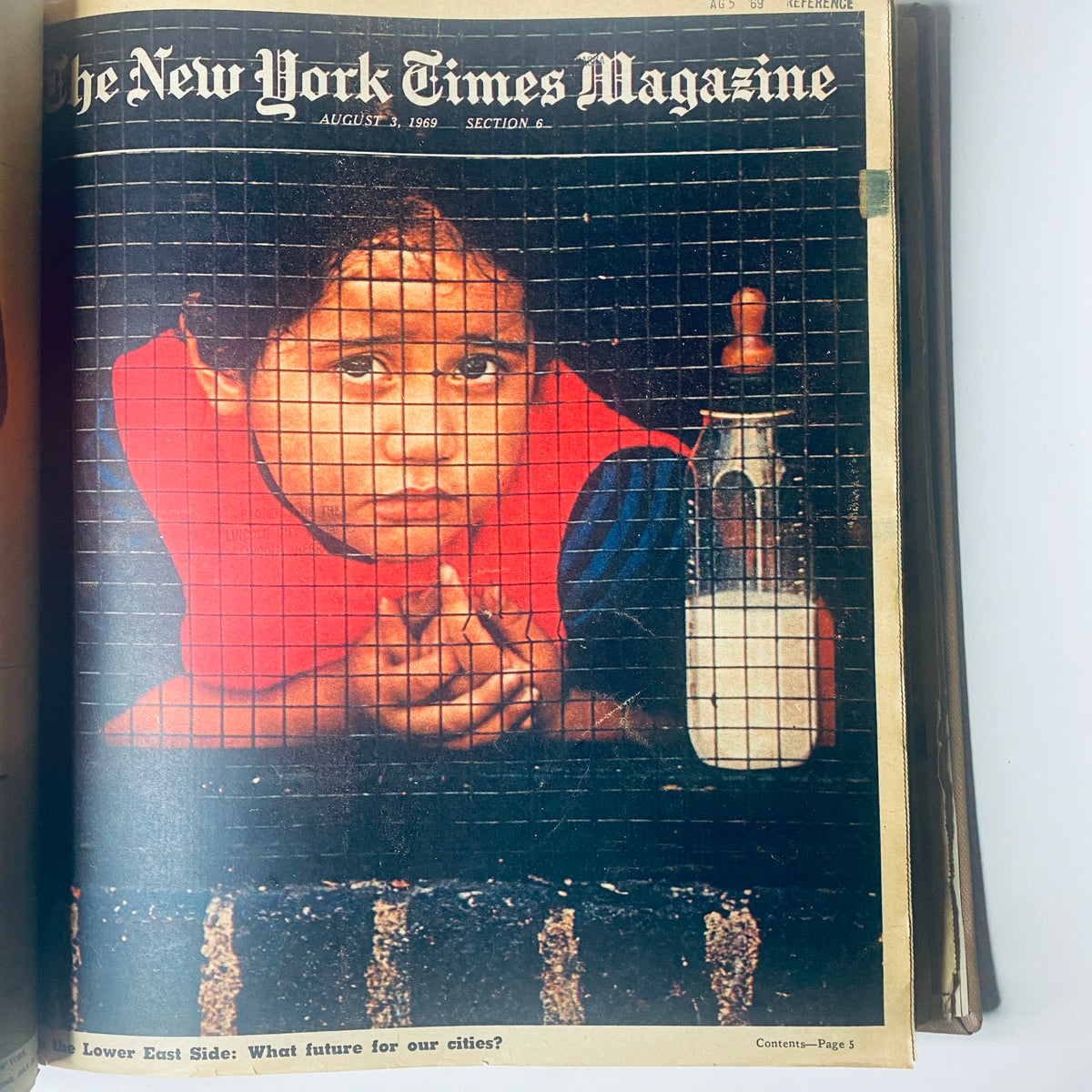 Cover of The New York Times Magazine, August 3, 1969, featuring a child behind a wire fence, raising questions about urban futures on the Lower East Side.