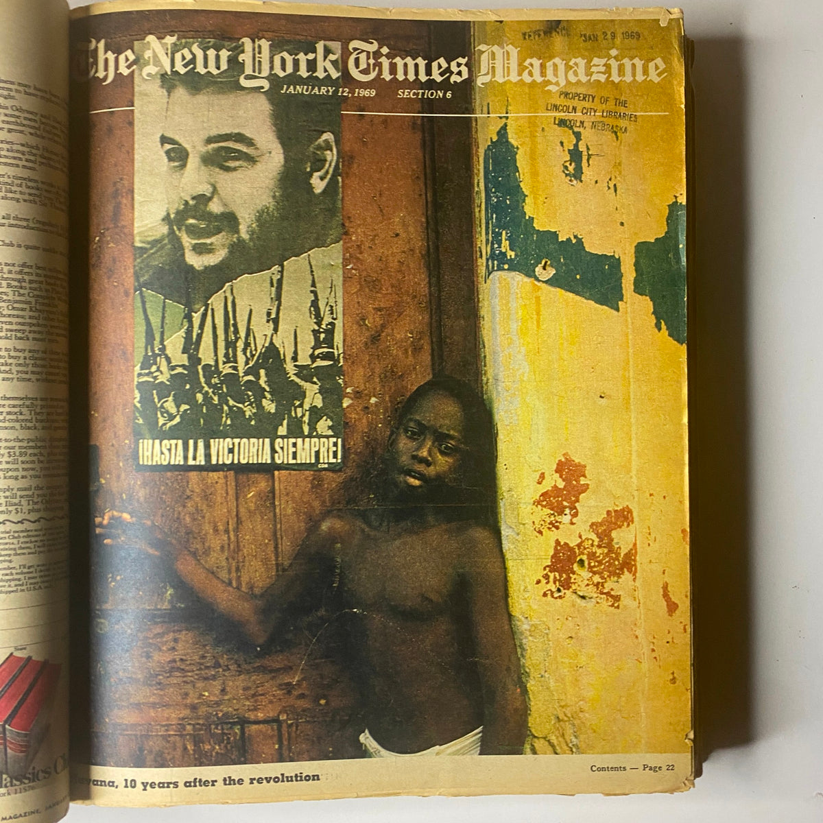 Inside page of The New York Times Magazine from January 12, 1969, featuring a striking image of a young child beside a revolutionary poster.