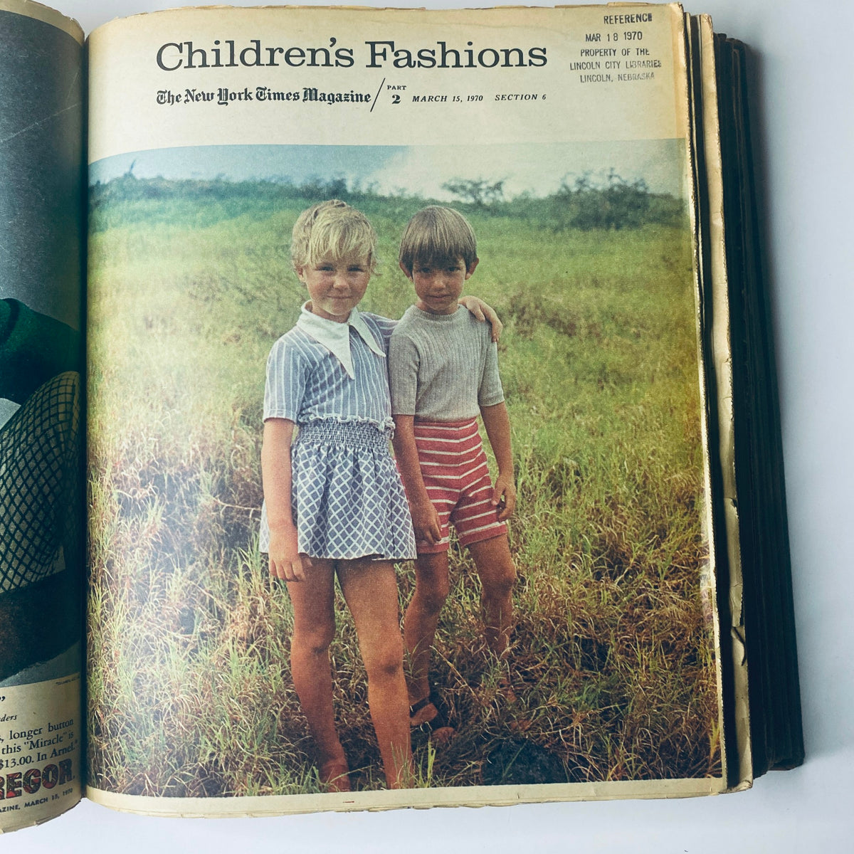 Children's fashion feature in 'The New York Times Magazine March 15, 1970,' showing two children in short outfits standing in a grassy field, Part 2.