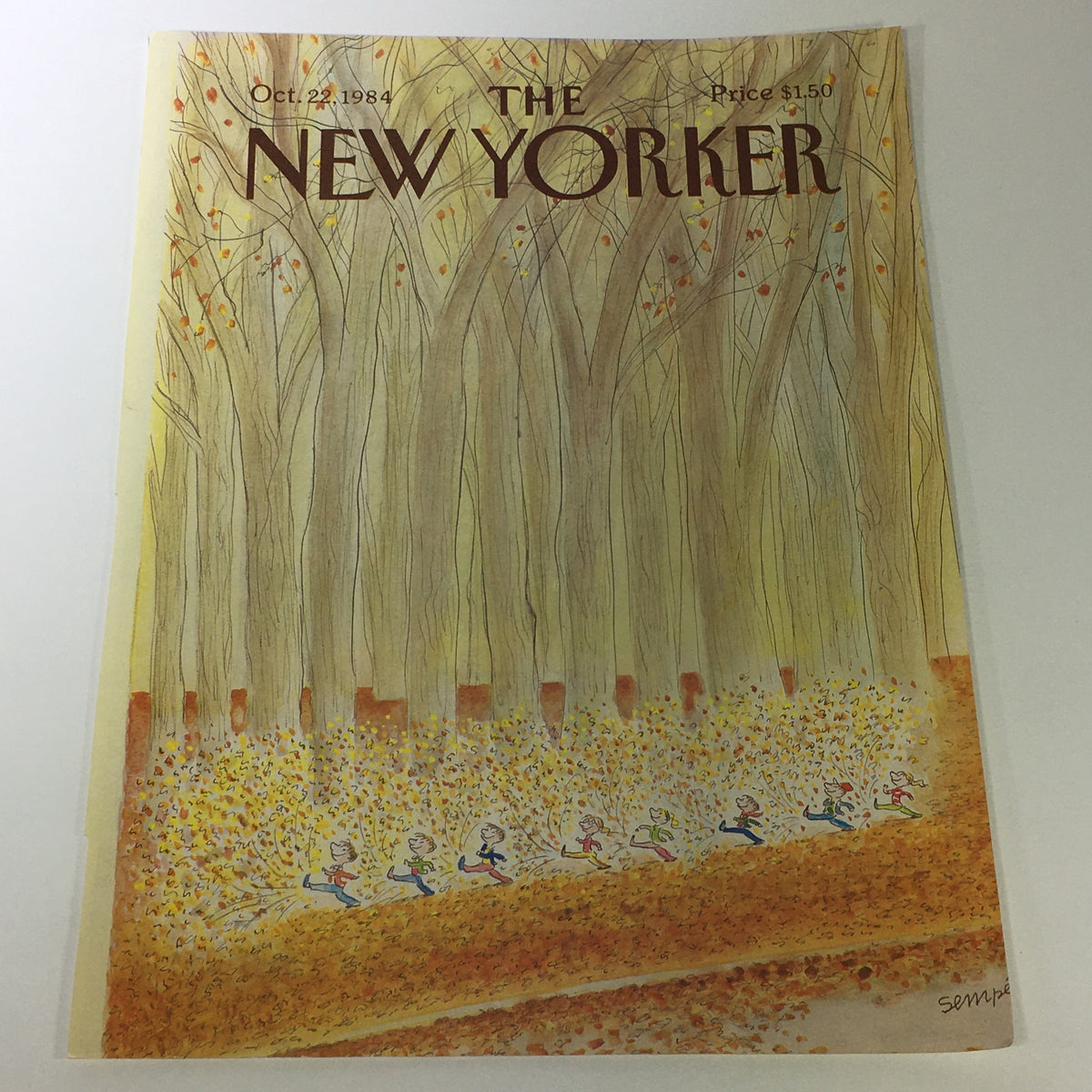 Vintage cover of The New Yorker Magazine from October 22, 1984, featuring whimsical illustration by Jean-Jacques Sempe, depicting a sunny autumn scene with children playing among fall foliage and trees.