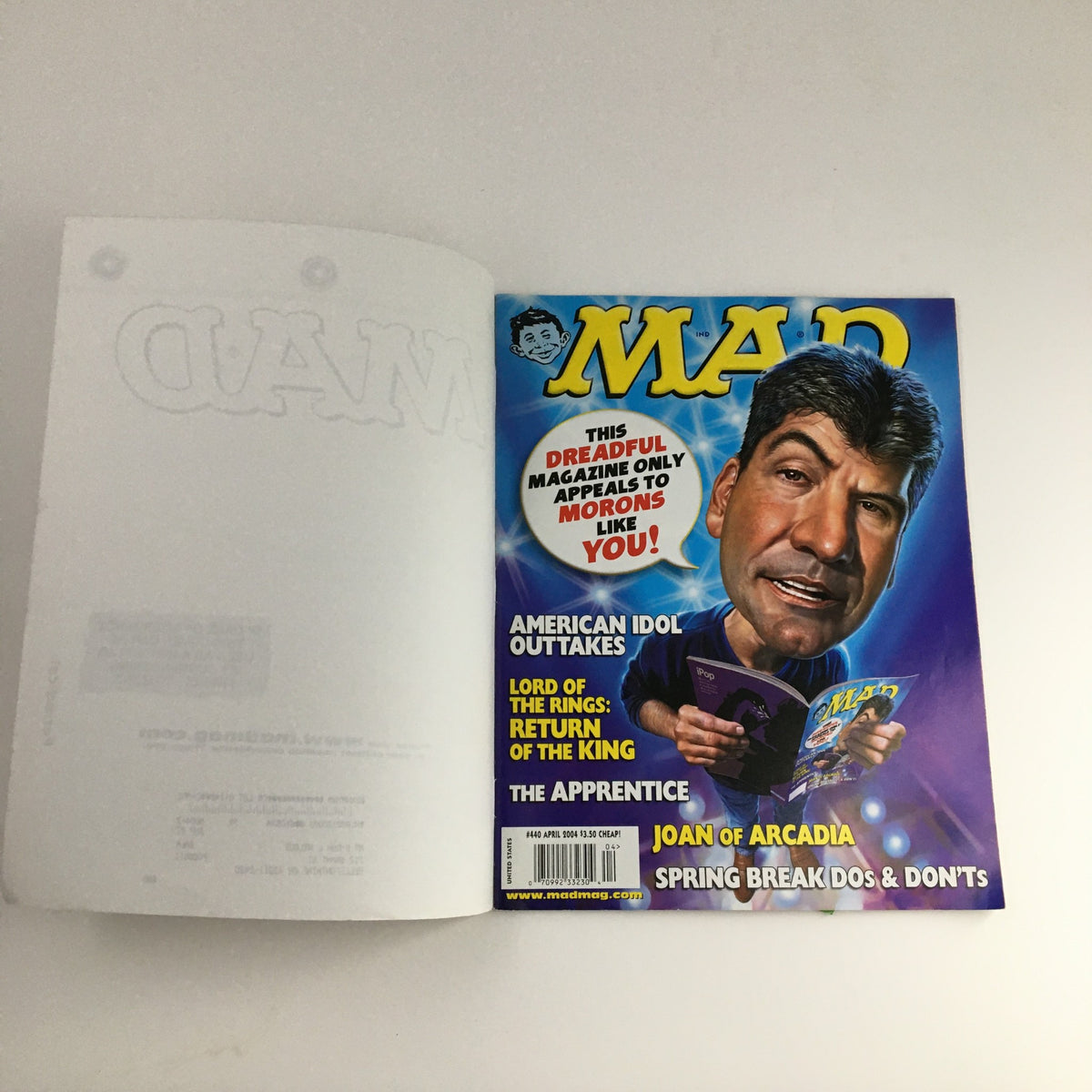 Cover of Mad Magazine April 2004 issue #440 featuring Simon Cowell, showcasing vibrant artwork and humor reflecting early 2000s pop culture.