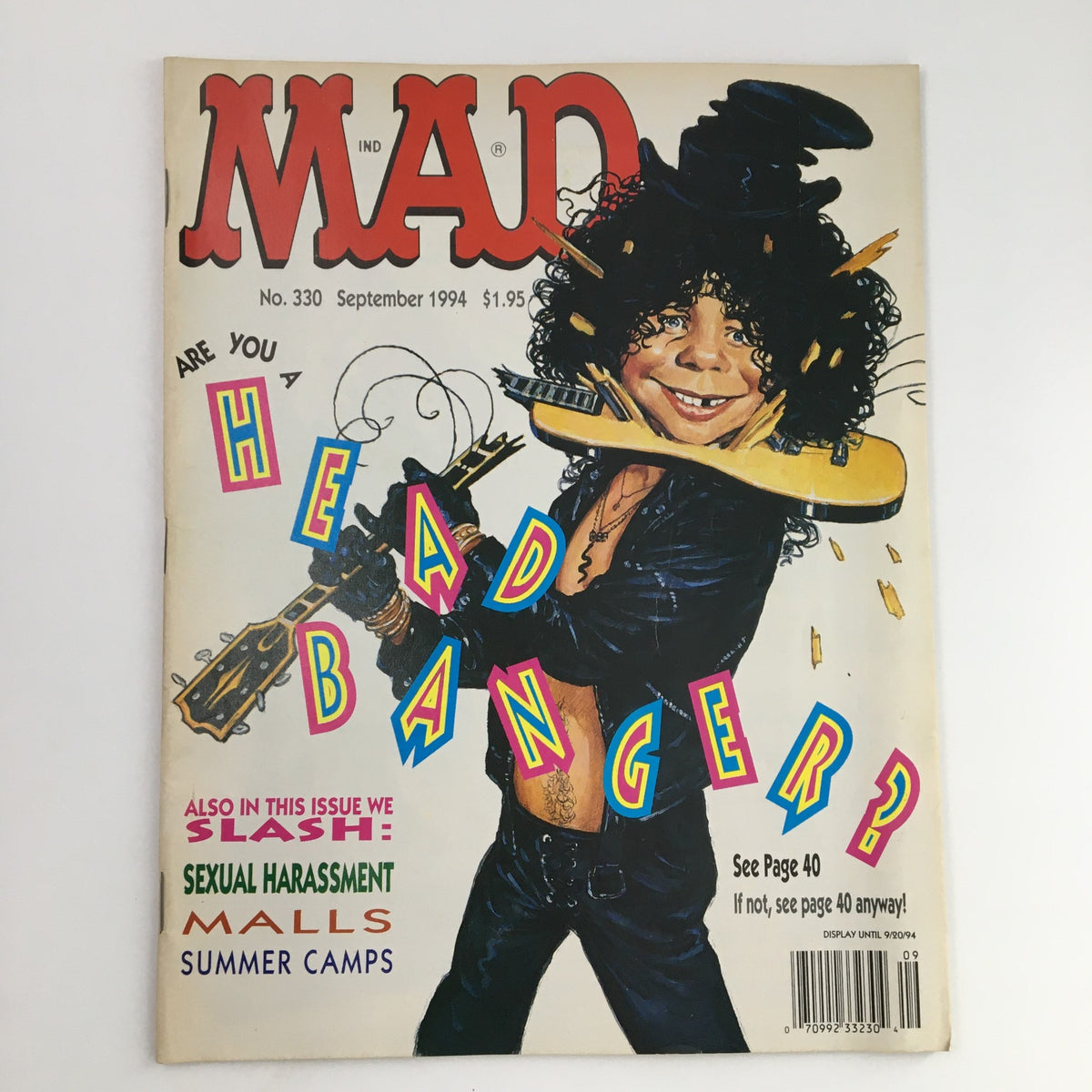 Cover of Mad Magazine September 1994 #330 featuring a caricature of a rock musician with a guitar, titled 'Are You a Head Banger?' showcasing vibrant colors and humorous style.