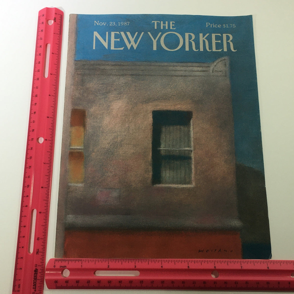 The New Yorker Magazine cover from November 23, 1987, featuring artwork by Brad Holland, displayed with a pink ruler for size reference.