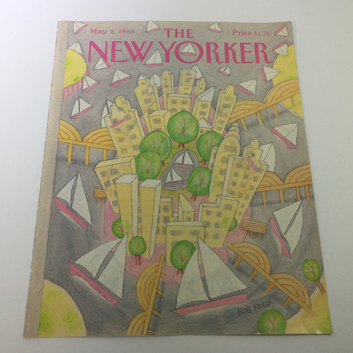 Cover only of The New Yorker Magazine from May 2, 1988 featuring colorful artwork by Bob Knox, depicting a vibrant cityscape with boats and trees.