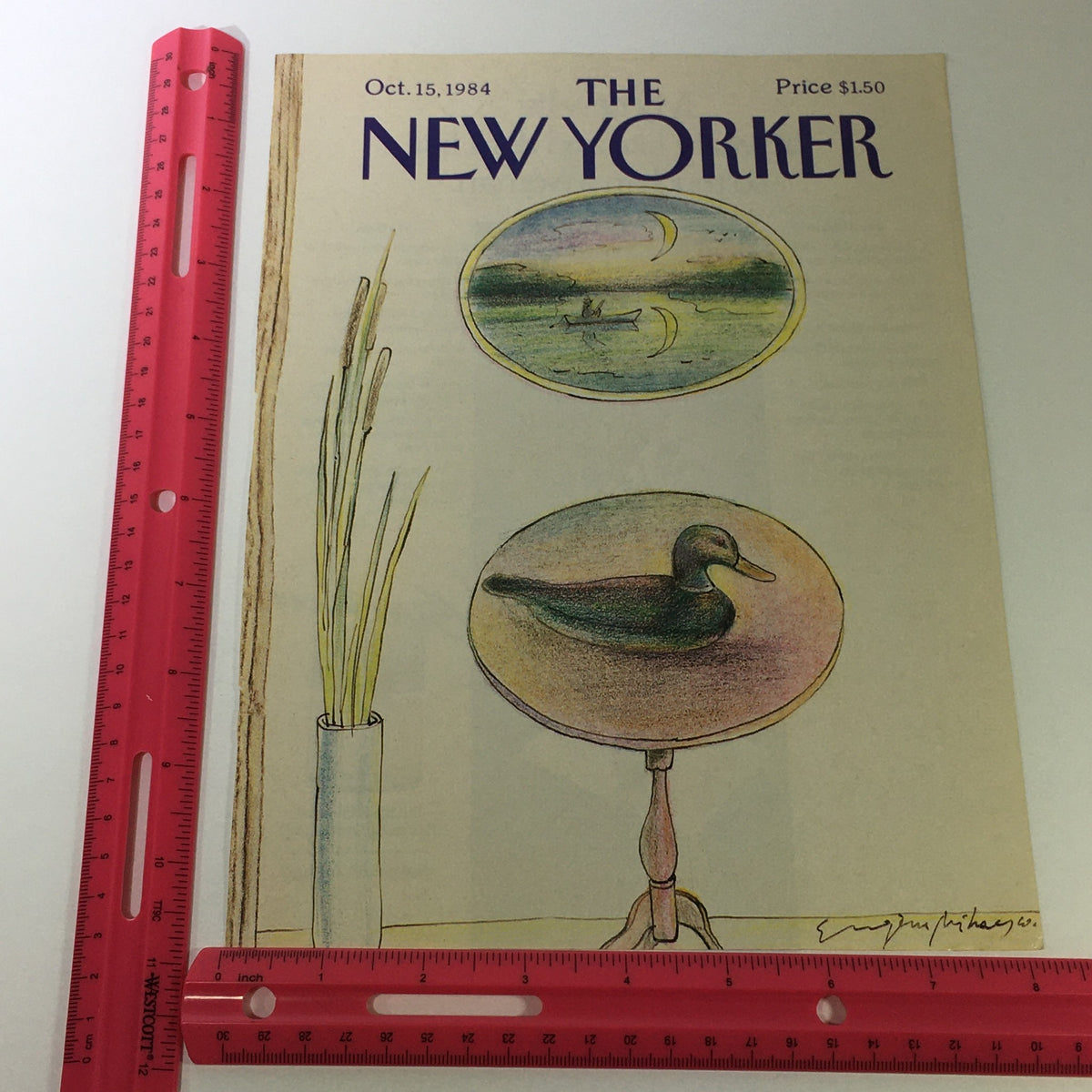 Detailed view of the October 15, 1984 cover of The New Yorker Magazine, highlighting the artistic illustrations created by Eugene Mihaesco. Includes a ruler for scale, showcasing the magazine's dimensions and unique design.