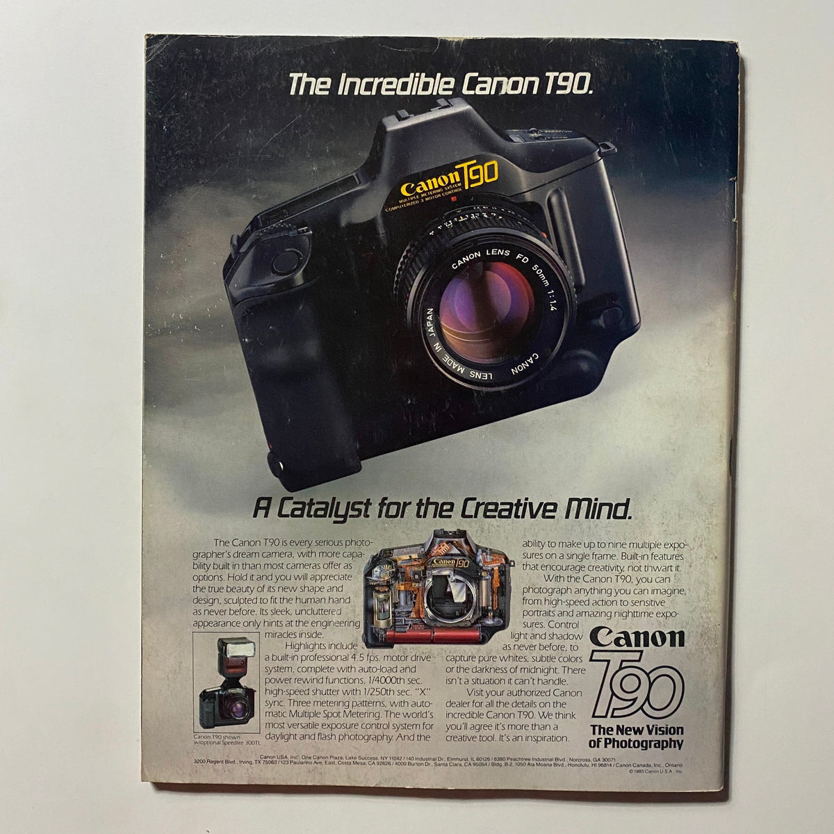 Back cover of Omni Magazine February 1986 showcasing an advertisement for the Canon T90 camera, emphasizing its features for creative photography.
