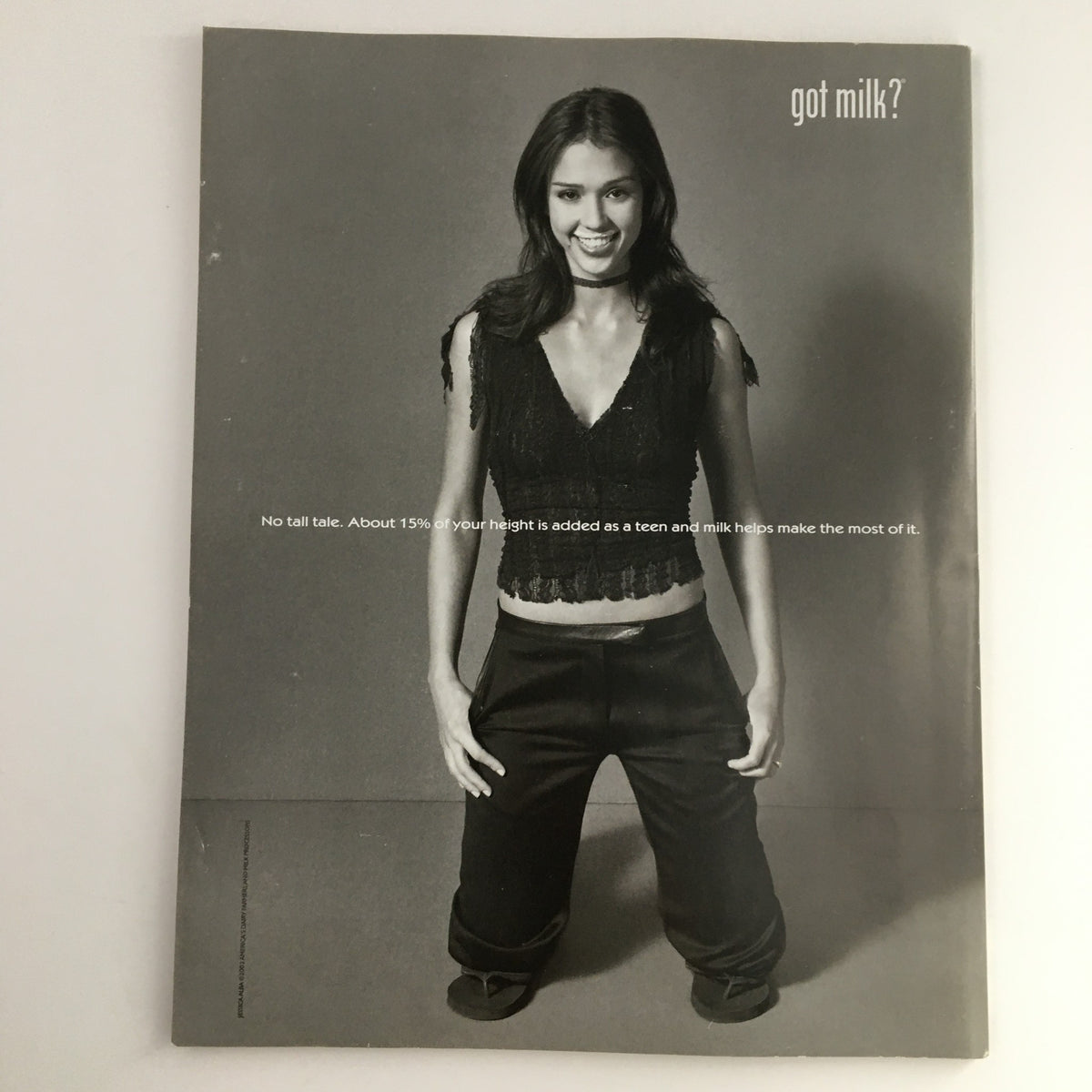 Advertisement with 'got milk?' slogan, showcasing a model promoting dairy in a creative black and white design.