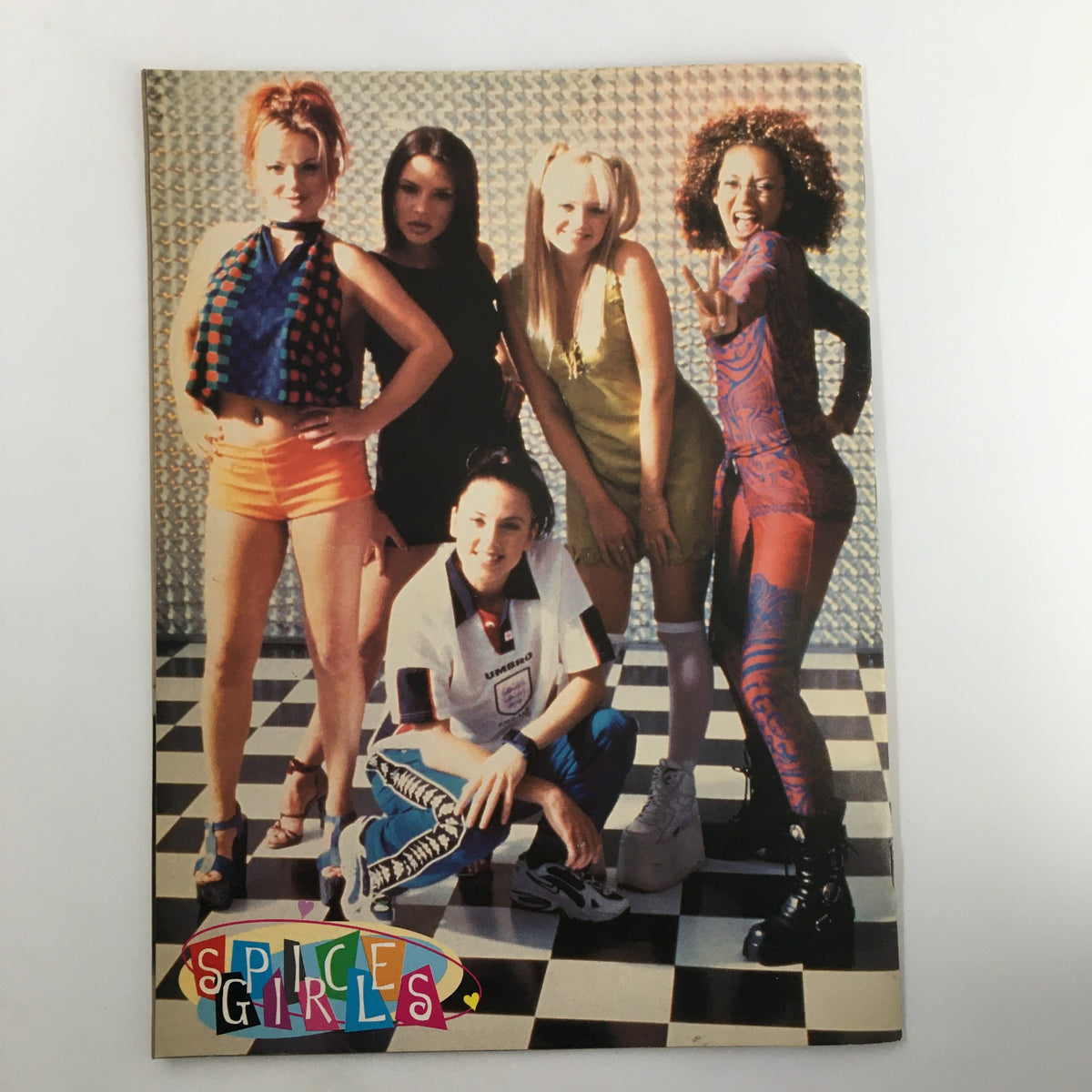 Colorful group shot of the Spice Girls from Superteen Magazine August 1998, highlighting their unique looks and the pop culture impact of the 90s. Volume 21, Issue 6.
