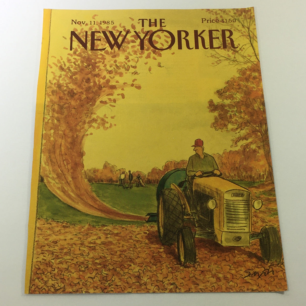 Cover of The New Yorker Magazine dated November 11, 1985, illustrated by Charles Saxon, featuring a scenic autumn landscape with a tractor and vibrant fall foliage.