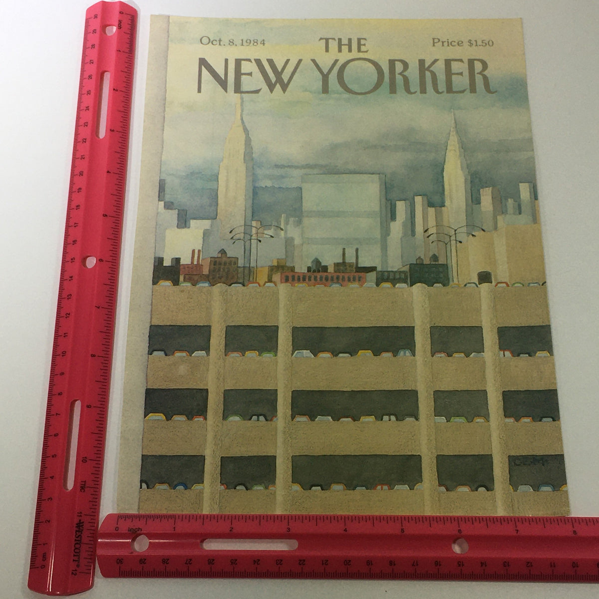 Cover of The New Yorker Magazine dated October 8, 1984, showcasing a city skyline including the Empire State Building, with a ruler for size reference, designed by Charles E. Martin.