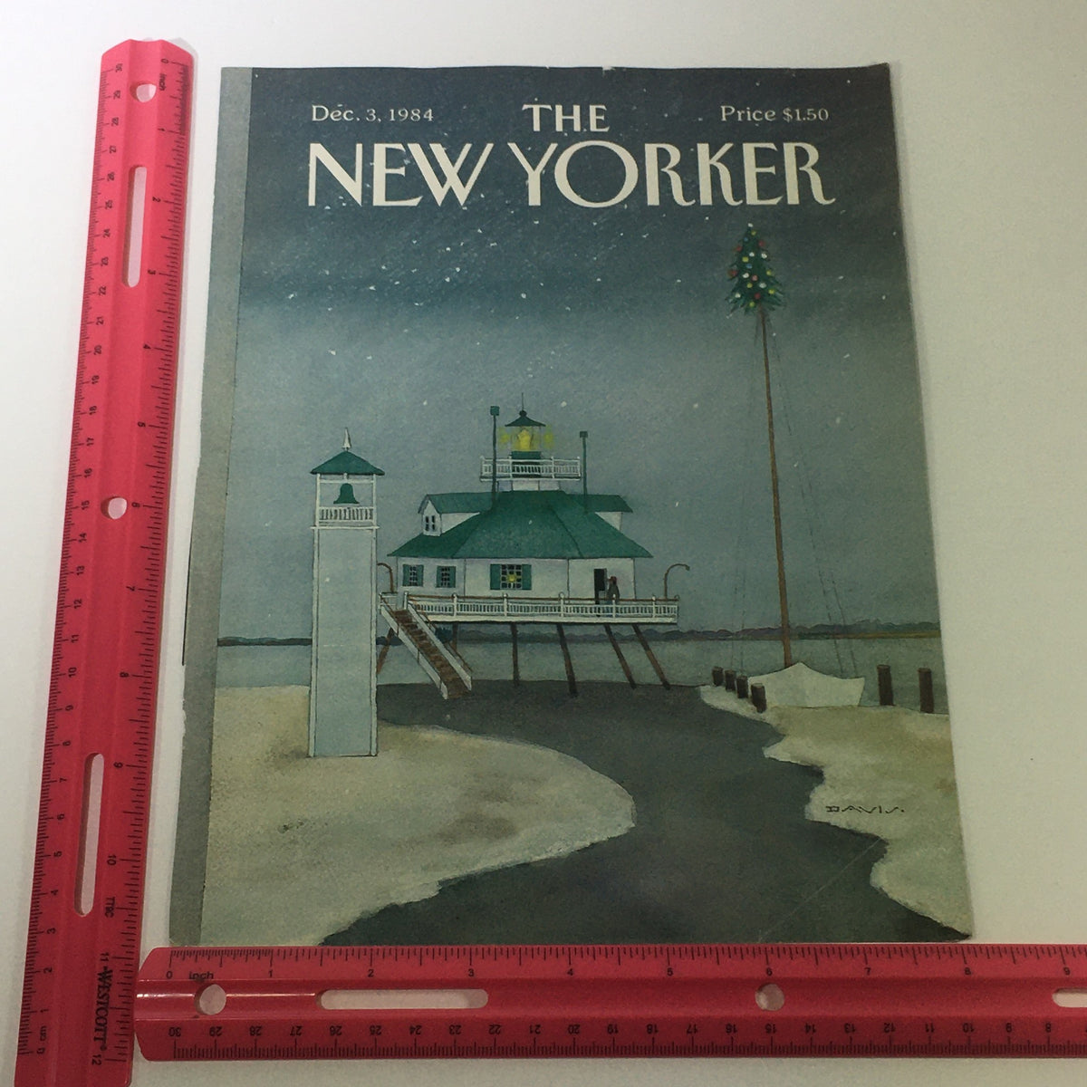 The New Yorker Magazine cover dated December 3, 1984, shown with a ruler for scale, featuring a captivating coastal scene by Susan Davis, ideally sized for display or framing.