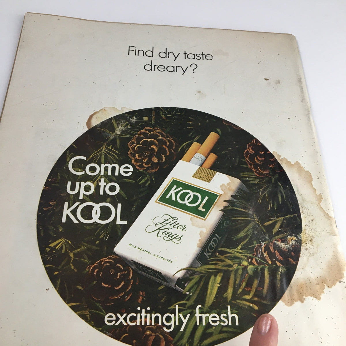 Cover of Life Magazine from December 12, 1969, featuring an advertisement for Kool cigarettes, highlighting the tagline 'Come up to KOOL excitingly fresh' against a backdrop of pine and natural elements.