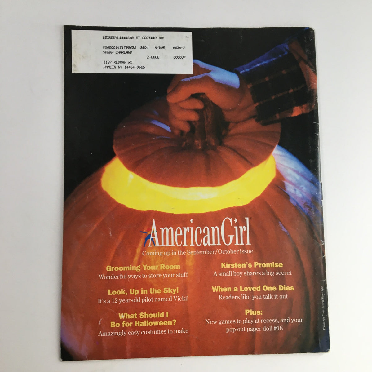 Back cover of American Girl Magazine July 1995 featuring a glowing pumpkin, with upcoming articles like 'Grooming Your Room' and 'What Should I Be for Halloween?'.