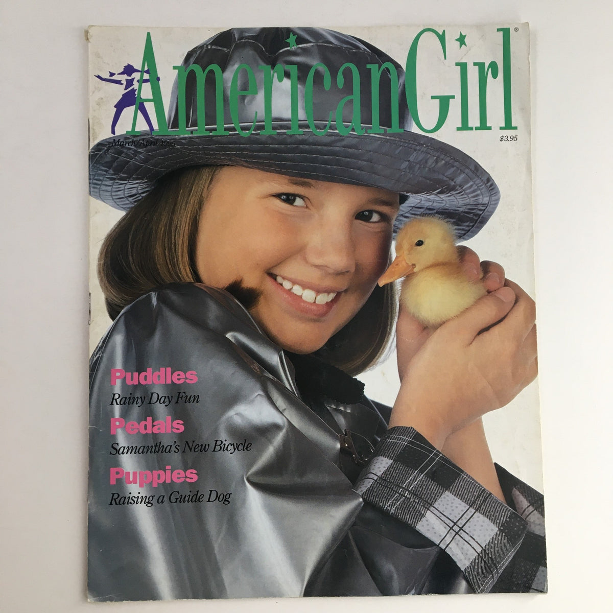 Cover of American Girl Magazine March 1995 featuring a girl in a gray hat holding a duckling, illustrating the theme 'Puppies Raising a Guide Dog'.