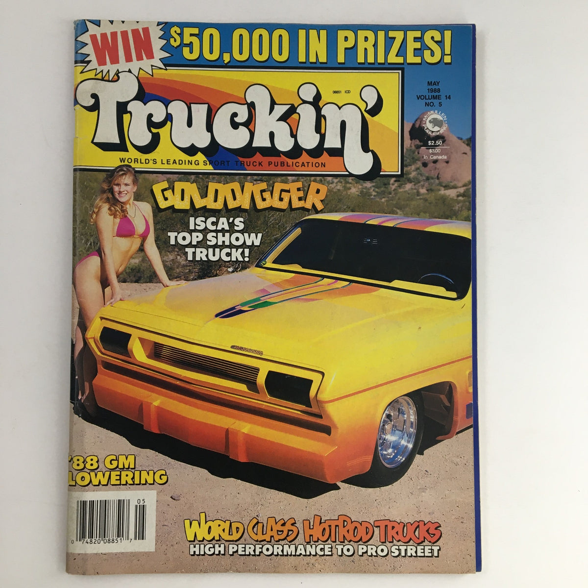 Cover of Truckin' Magazine May 1988 featuring a striking hot rod truck, the Goldigger, with vibrant colors and a bikini-clad model. Highlights ISCA's top show truck and showcases vintage automotive culture.