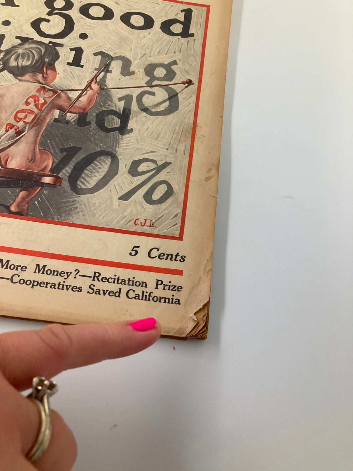 Close-up of the VTG The Farm Journal Magazine January 1923 cover detailing its lower section, mentioning topics like Recitation Prize and cooperatives that boosted California, underlining the magazine's focus on agricultural advancement.