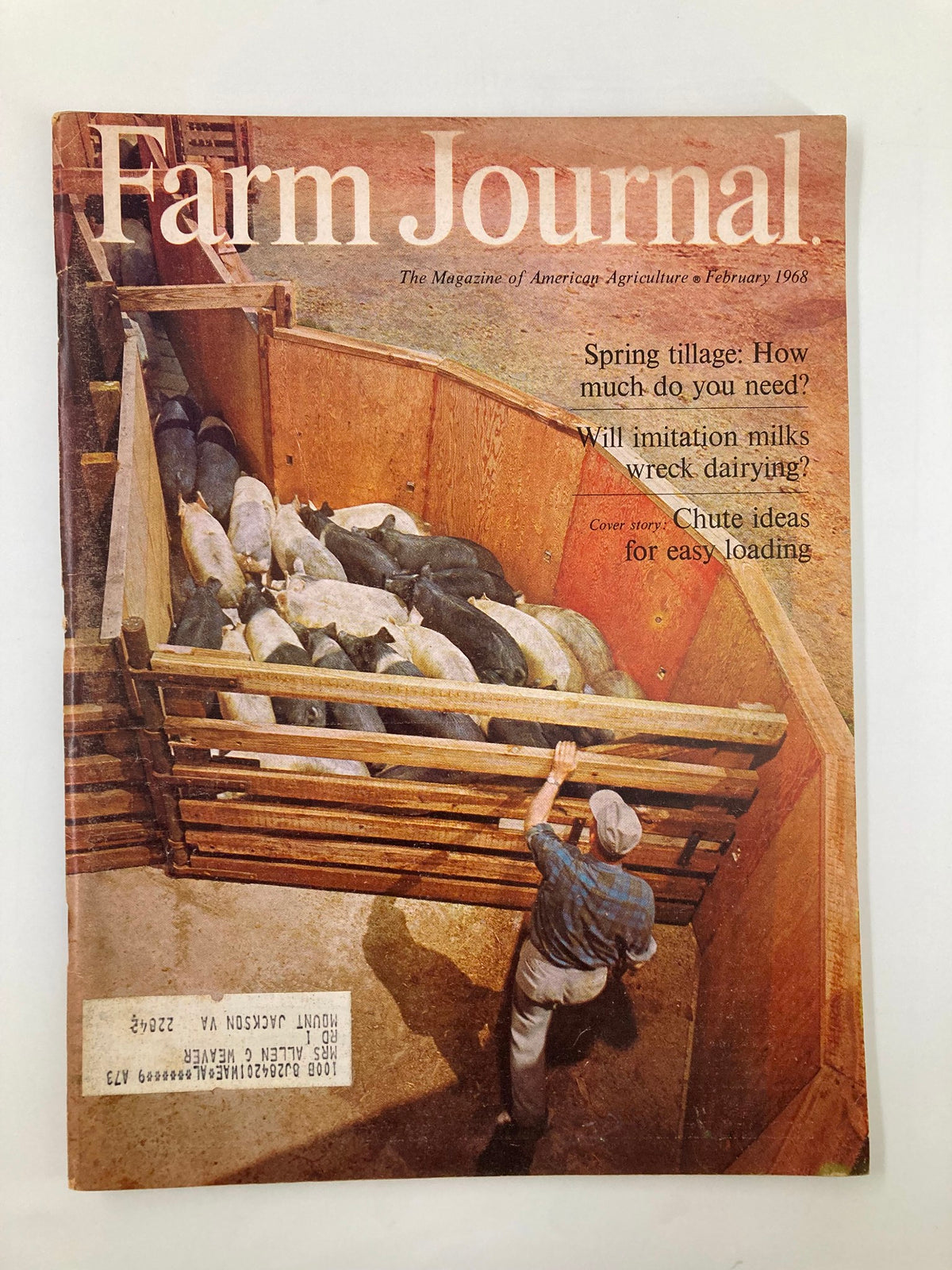 Cover of VTG Farm Journal Magazine February 1968 featuring livestock loading techniques, including chute design ideas for easy handling in agriculture.