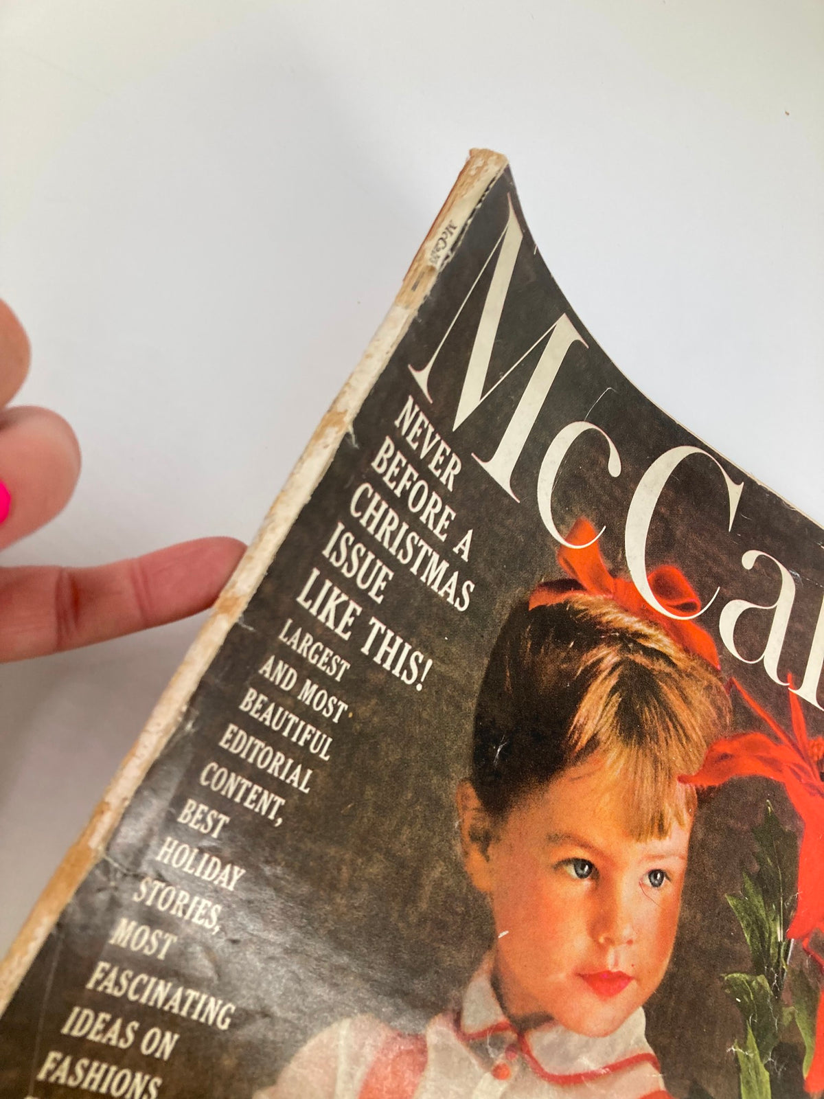 Close-up view of the VTG McCall's Magazine December 1959 Cover, highlighting the title and the young girl with a festive plant, emphasizing holiday cheer.