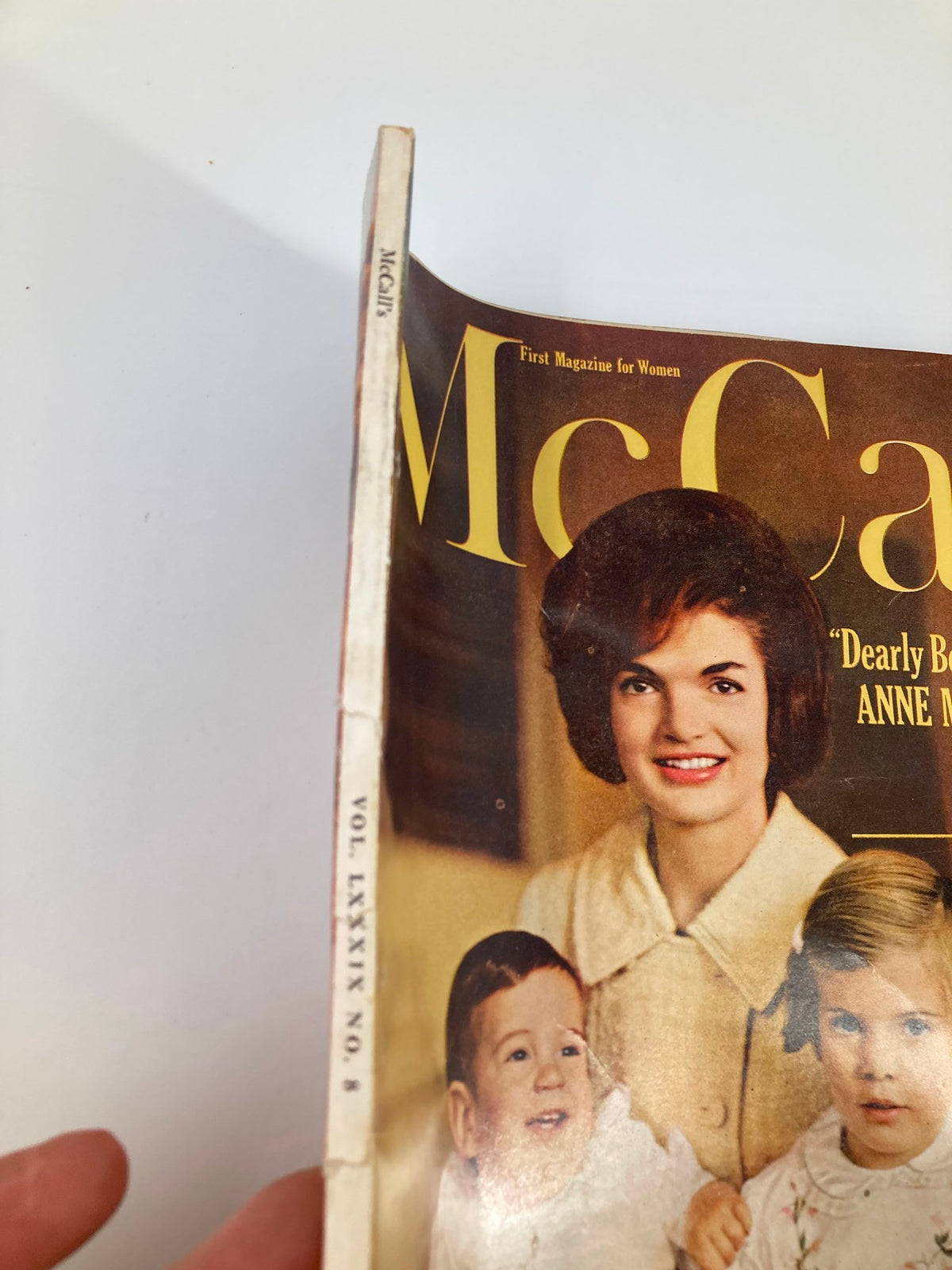 Side view of the VTG McCall's Magazine May 1962 highlighting the spine with 'McCall's' and the volume details, depicting the vintage aesthetic of the publication.