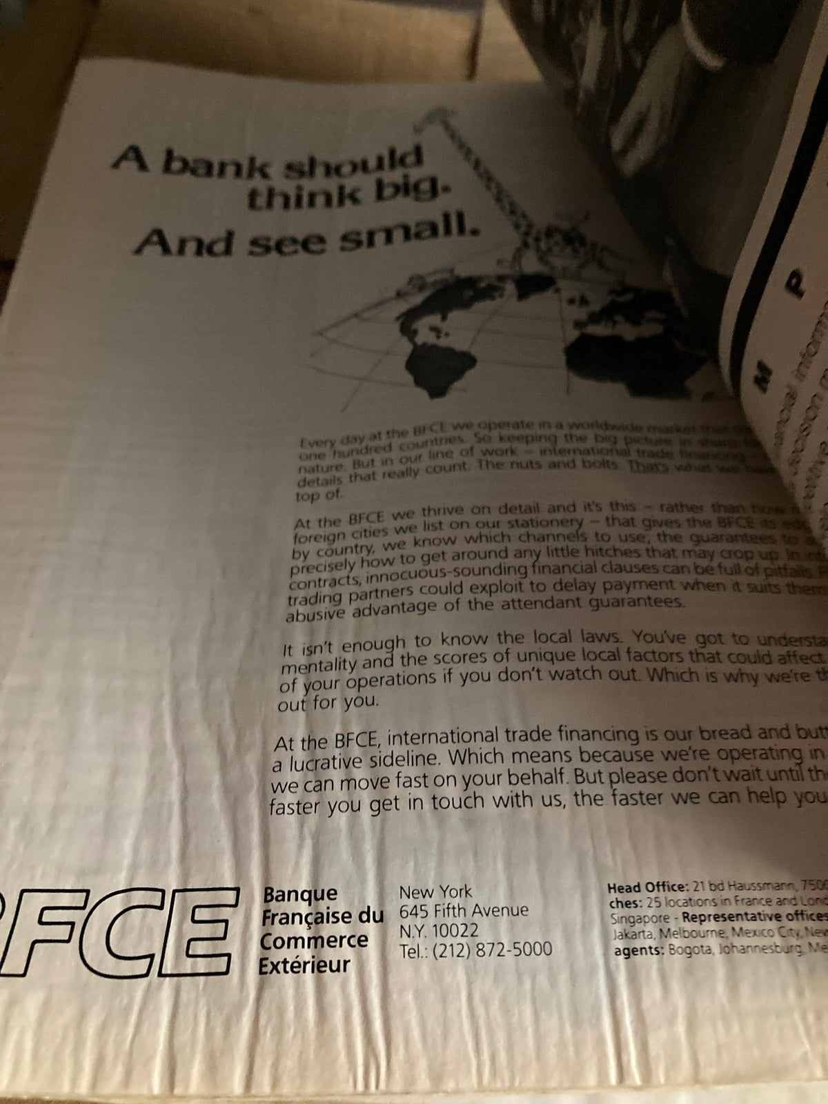 Advertisement page from the VTG Business Week Magazine December 31 1984 titled 'Investment Outlook: Untamed Budget', promoting banking services with a focus on international trade financing, emphasizing attention to detail.