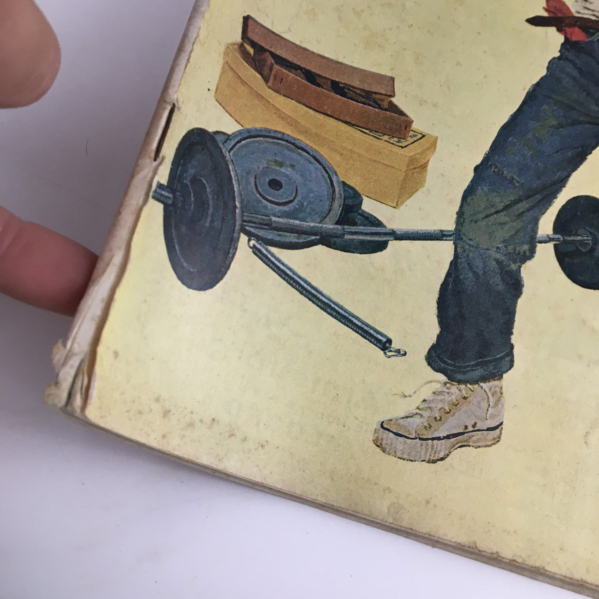 Close-up view of the cover of The Saturday Evening Post March 14 1959 showing the boy lifting weights and details of the vintage magazine's age.