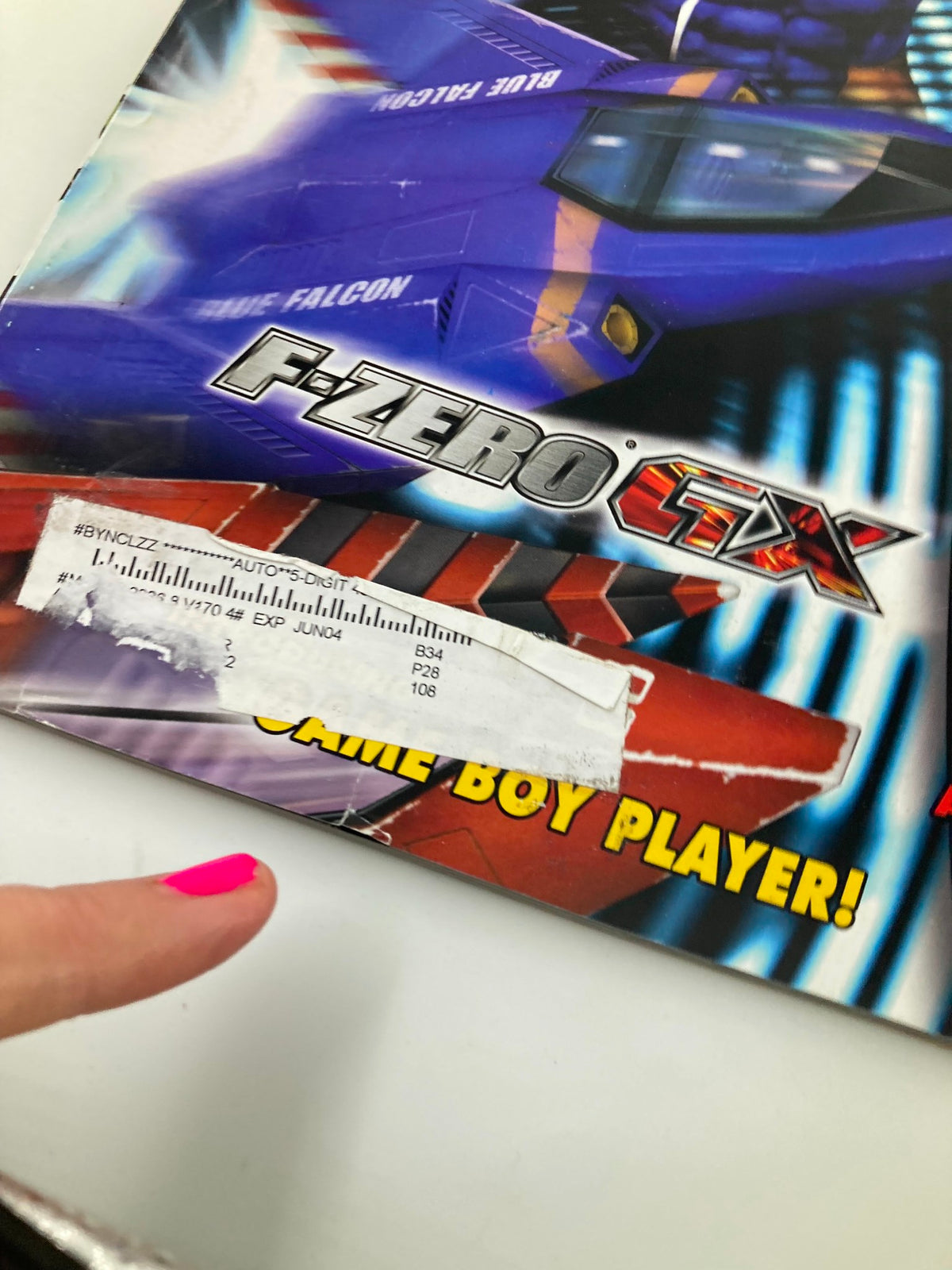 Close-up of the cover edge of Nintendo Power Magazine July 2003 #170 with F-Zero GX and a label visible.