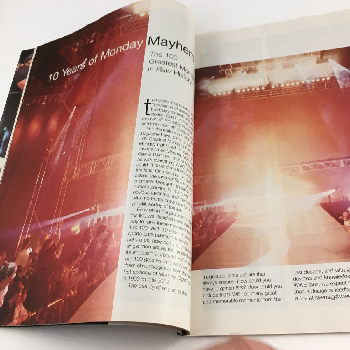 Inside page of WWE Raw Magazine Holiday 2002 discussing 10 Years of Monday Night Raw, reflecting on memorable moments in wrestling history with a dramatic photograph.