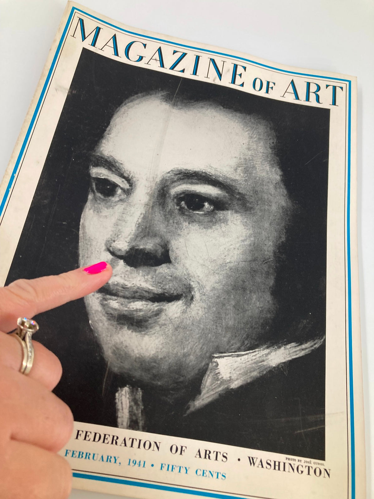Close-up of the cover of Vintage Magazine of Art February 1941, highlighting the portrait and a finger pointing at the detail.